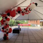 Red, white and black balloon garland