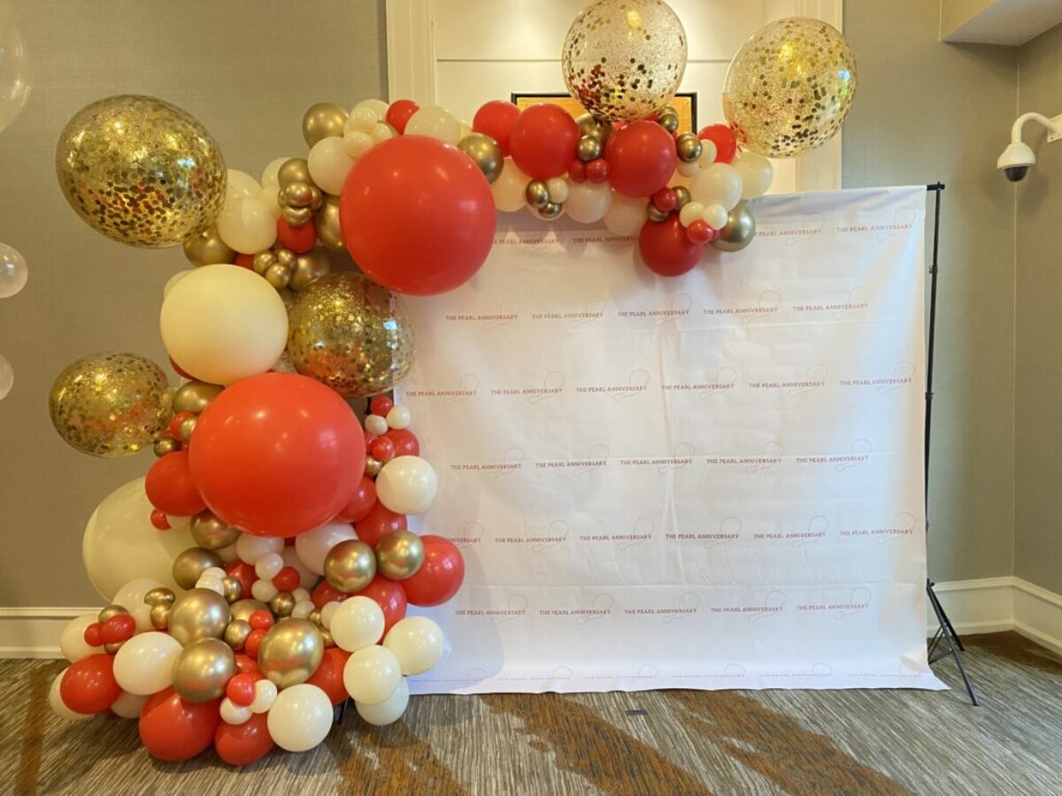 Large gold, red and white balloon backdrop